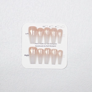 Macro detail of aurora gradient press-on nails in long coffin shape on display card