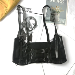 Detail of black PU leather punk corset belt with adjustable straps and metal buckles