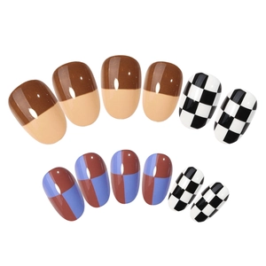 Short round press-on nails with brown checkered pattern and glossy finish on white base