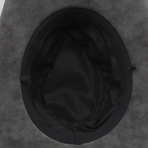 Detailed view of the dark felt cowboy hat interior with ribbed sweatband and fabric lining
