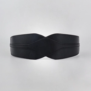 Detail of black wide waist belt featuring diamond stitched patterns and leather texture