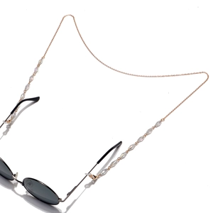 Rose gold glasses chain with 10mm oval crystal beads on black sunglasses