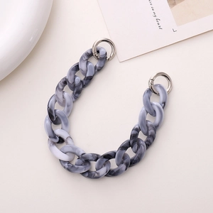 Gray marble texture acrylic chain strap with silver metal buckles on beige background