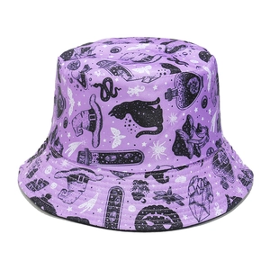 Close-up of purple bucket hat with black gothic witch symbols and moth patterns
