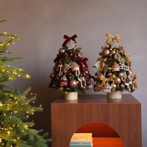 Mini desktop Christmas tree set with gold bows, reindeer ornaments, and LED lighting decor