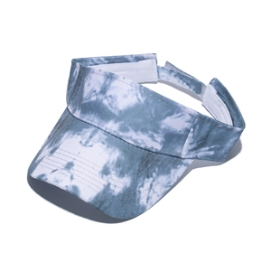 Detail of blue and white tie-dye sun visor hat with adjustable velcro strap closure