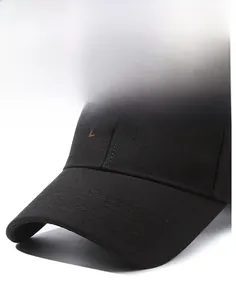 Detailed view of the black cotton baseball cap with high-quality brown ELEVEN embroidery