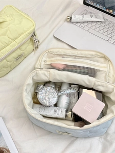 Quilted cloud cosmetic bag in lemon yellow and light blue with spacious compartments