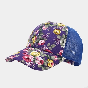 Detail of floral printed fabric and breathable blue mesh on the baseball cap