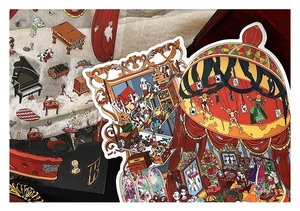 Detail of vintage theater stickers with piano and doll patterns on a wooden tray