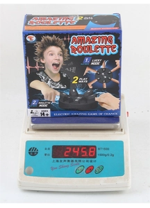 Macro shot of the lie detector game box on a scale showing 245.8g weight specification