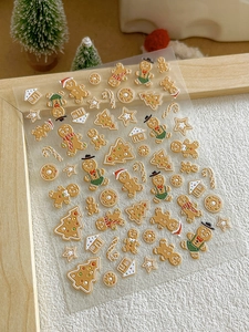 Christmas gingerbread man nail stickers with 3D embossed holiday patterns on wood