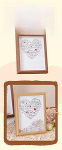 Detail of wooden DIY shadow box frame with multilingual I Love You heart and colorful capsules