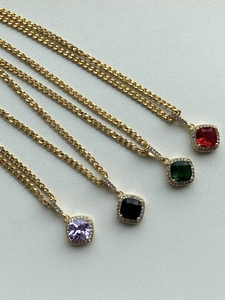Macro view of four-color square zircon necklaces with 18k gold plating and stone inlay