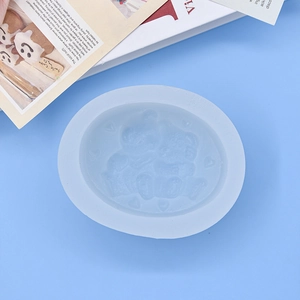Oval light blue silicone mold featuring two bears and a heart for DIY baking and soap