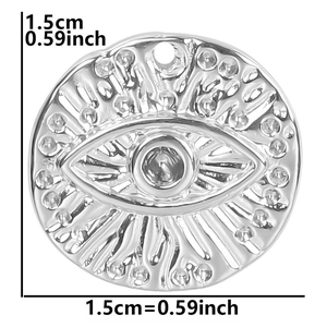 Macro detail of silver stainless steel evil eye pendant with 1.5cm dimension markings