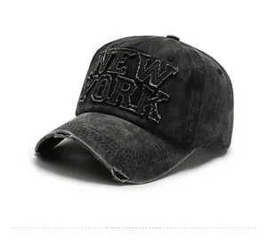 Detail of washed black baseball cap with 3D New York embroidery and distressed brim