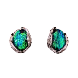 Vintage style silver needle earrings with blue-green resin stones on white background