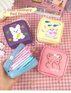 Detail view of colorful cartoon storage pouches showing internal capacity for sanitary pads
