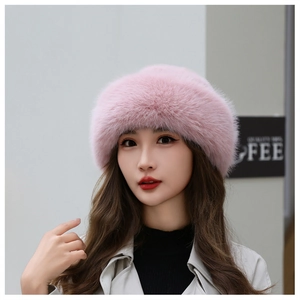 Close-up of pink faux fur winter hat with thick fluffy texture and warm Mongolian style