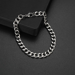Mens hip hop style silver Cuban link chain bracelet in stainless steel on black background