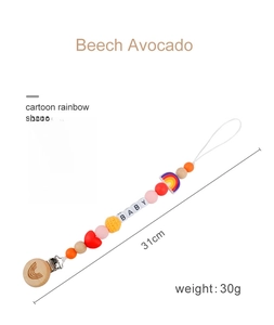 Detail view of beech wood baby pacifier chain with silicone beads and rainbow pendant