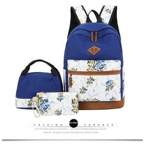 Three-piece floral canvas set including backpack, lunch bag and pencil case with leather accents