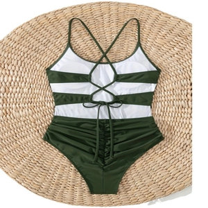 Olive green and white ruched one-piece swimsuit with criss-cross back and bow detail