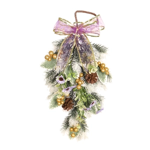Christmas teardrop swag with purple star ribbon, golden berries, and frosted pine needles