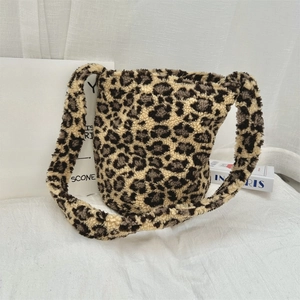 Detailed view of the leopard print plush texture on this oversized winter bucket bag