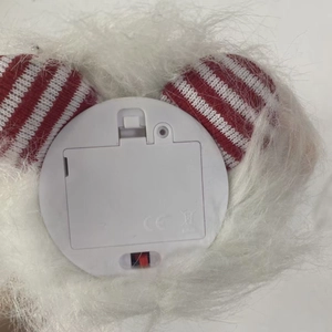 Detail of Christmas gnome battery compartment with power switch and CE mark