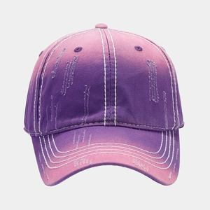 Detailed view of the purple pink gradient baseball cap with distressed rip effects