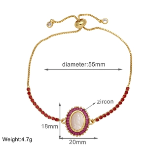 Detail of adjustable gold-plated bracelet with red zircon and size measurements