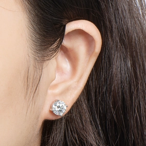 Detailed macro view of a 2ct D color moissanite stud earring with 4-prong silver setting
