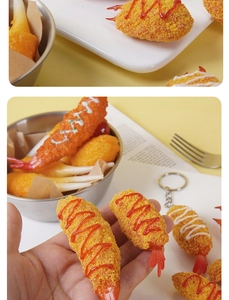 Macro view of realistic fried shrimp tempura keychain with breadcrumbs and sauce detail