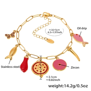 Detail of 18k gold plated stainless steel bracelet with colorful enamel charms and lobster clasp