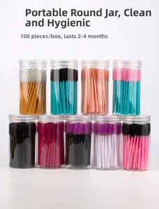 Detailed view of disposable spiral eyelash brushes in transparent storage tubes