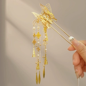 Golden butterfly hair pin with long tassels and pearls in a traditional Chinese style