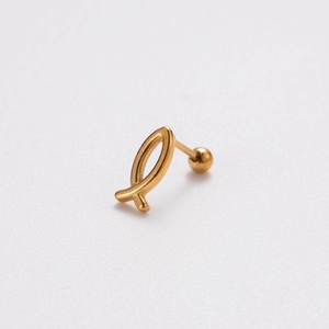 Detailed close-up of a gold star-shaped stainless steel cartilage stud earring