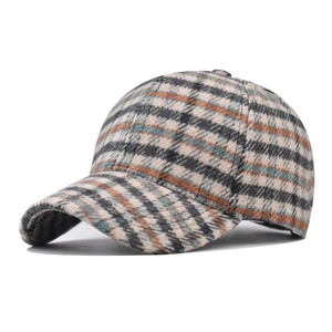 Retro houndstooth plaid baseball cap with orange and green patterns on white base