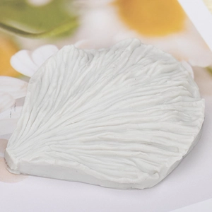 Detailed white Austin rose petal silicone mold showing realistic floral vein textures