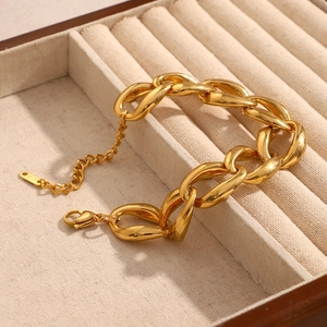 Detail of 18K gold plated stainless steel chunky chain bracelet with K18 tag in jewelry box