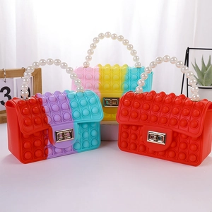 Silicone pop-it fidget handbag for kids with pearl handle and metal lock