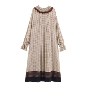 Elegant beige floral print maxi dress with ruffle neck and contrast black hem details