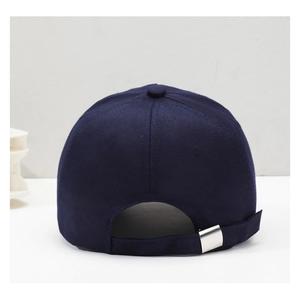 Rear view of navy blue cotton baseball cap with adjustable silver metal buckle strap