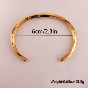Top view showing 6cm inner diameter measurement of the gold Mobius stainless steel bangle