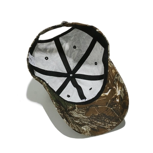 Detail of 100% cotton camouflage baseball cap showing internal sweatband and metal buckle