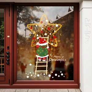 Adesivi natalizi per finestre con Babbo Natale sulla scala e stelle d'oro su vetro
