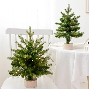 Nordic mini artificial Christmas tree with wood base and warm LED lights for tabletop decor