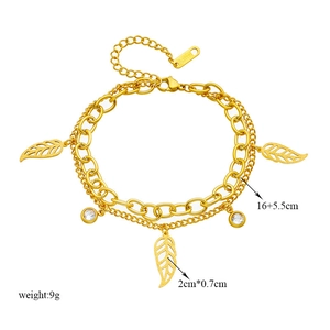 Double-layered gold stainless steel chain bracelet with leaf and crystal pendants